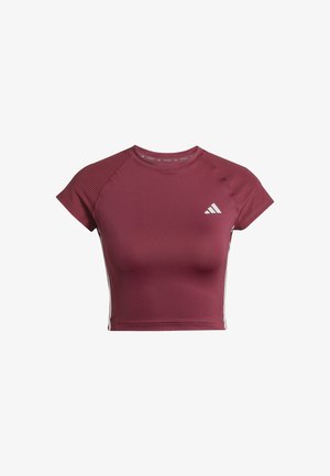 Maroon athletic crop top made of smooth fabric. Features short sleeves and ribbed detailing on the shoulders. White logo on the chest.