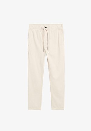 Beżowe, lekkie spodnie bawełniane z elastycznym paskiem do regulacji, bocznymi kieszeniami i zapięciem na guzik, o gładkiej fakturze.