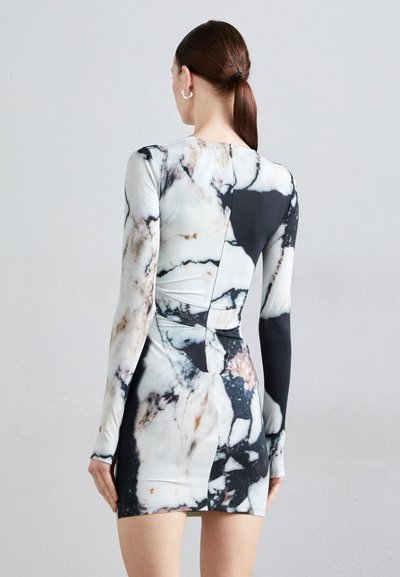 Long-sleeve bodycon dress featuring a marble print in black and white, with a fitted silhouette and a back cutout detail.
