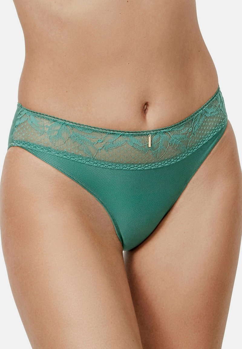 Teal kanten slip met een bloemenkant tailleband en textuurmateriaal, met een klein gouden accent detail nabij de tailleband.