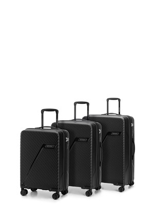 Three black suitcases made of textured hard-shell material. Each has a retractable handle and four wheels for mobility. Notable angled patterns.