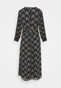 Robe midi noire à manches longues, taille cintrée, fermeture éclair dans le dos et motif chevron blanc à pois.