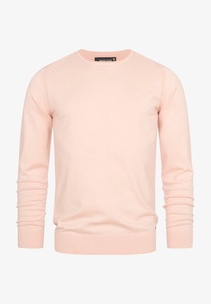 Lys rosa genser med rund hals, lange ermer, ribbestrikkede mansjetter og kant. Laget av mykt stoff, med jevn tekstur og minimalistisk design.