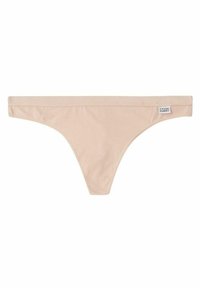 Nude väristä puuvillainen stringi, jossa on ohut vyötärönauha, minimaalinen peittävyys ja lappu oikealla puolella. Sulava rakenne, yksinkertainen muotoilu, ilman kuvioita.