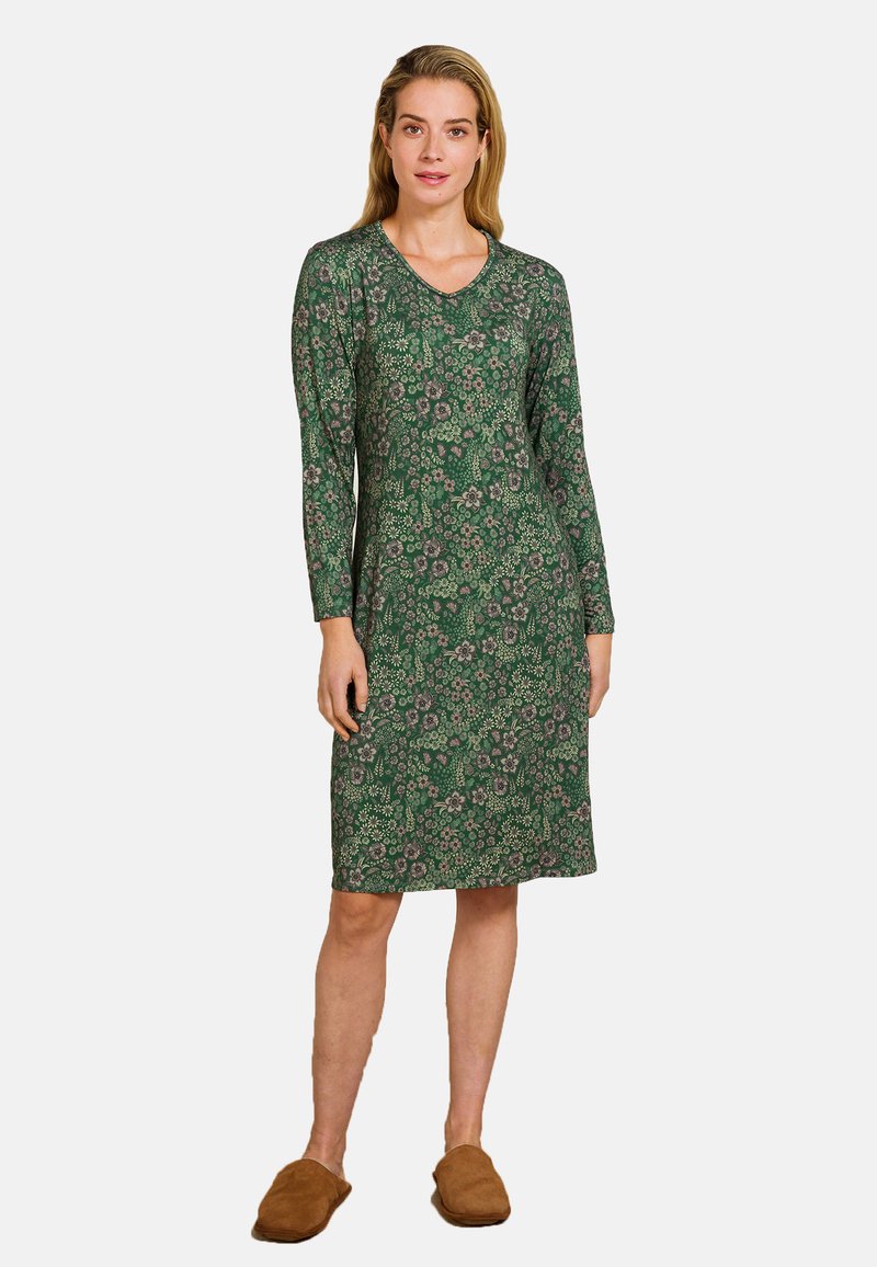 Langsleeve groene jurk met een bloemenpatroon in paars en crème, met een V-halslijn en een knielange snit. Zachte stofstructuur.