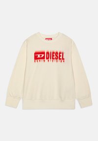 Felpa color crema con maniche lunghe, caratterizzata da un logo "DIESEL" stampato in rosso e un effetto sfumato sulla parte anteriore. Tessuto morbido.