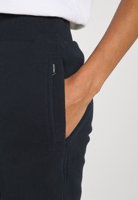 Superdry & Co Träningsbyxor - dark blue