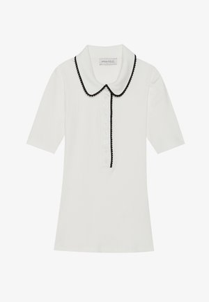 White ribbed short-sleeve top with black scalloped collar and button front closure. Features a textured fabric and tailored fit.