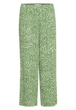 Zelené vzorované nohavice s abstraktným dizajnom a geometrickými tvarmi na svetlom pozadí. Látka má hladkú štruktúru a rovný strih.