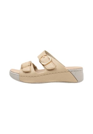 Sandale beige à bout ouvert avec deux sangles réglables à boucle et un petit talon compensé.