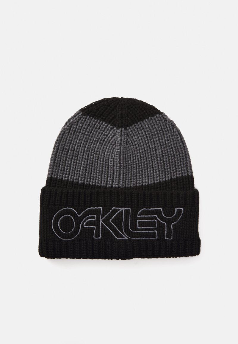 Knit beanie in black and grey with a folded cuff. Features "OAKLEY" embroidered in grey on the front. Textured ribbed material.