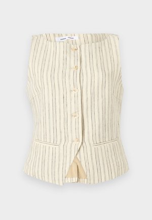 Brezrokavnik bež barve z navpičnimi črtami, zapenjanjem na gumbe spredaj, dvema stranskima žepoma in rahlo razširjenim robom. Tekstura je videti lahka in zračna.