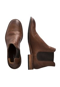 Bottes Chelsea en cuir marron avec panneaux latéraux élastiques, bout rond et talon en bois empilé. Fini lisse et détails de couture.