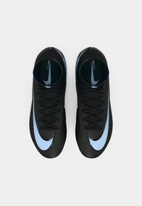Pair of black high-top Nike Mercurial soccer cleats with light blue swoosh logos viewed from above on a white background.