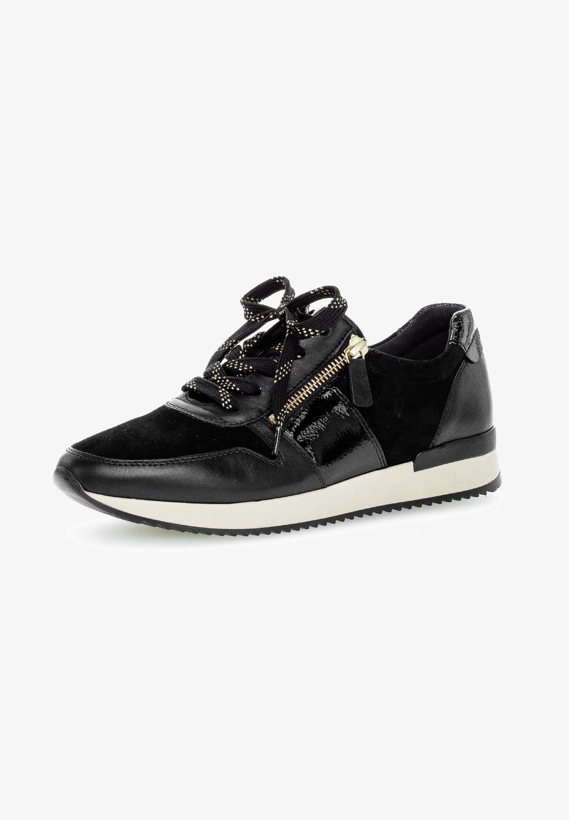 Baskets noires avec semelle blanche, lacets noirs et blancs, fermeture éclair latérale et matériaux en cuir et suède mélangés.