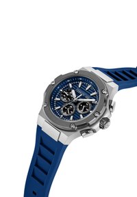 Orologio sportivo con cinturino in gomma blu, cassa in acciaio inossidabile argentato, quadrante blu con texture, tre sottodial neri e indicatori delle ore argentati.