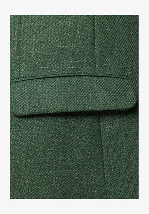 Zielona fakturowana tkanina w wzór w jodełkę, z detalem podwiniętego mankietu. Materiał wydaje się tkany i lekko szorstki.