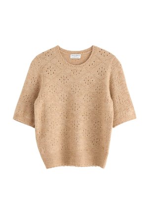 Maglione a maniche corte color beige in maglia con motivo traforato. Collo rotondo e dettaglio a coste sull'orlo. Tessuto leggero e casual.