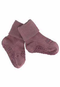 Chaussettes pour tout-petit de couleur violette douce, avec des grips en caoutchouc antidérapants sous la semelle et des bordures repliées, conçues pour le confort et la sécurité à l'intérieur.