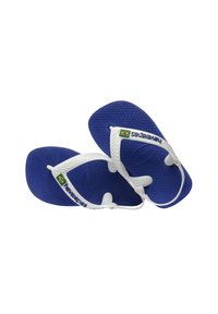 Chanclas de goma azules con correas blancas. Las correas presentan el logo "Havaianas" y un detalle de la bandera de Brasil en verde, amarillo y azul. Suela texturizada para agarre.