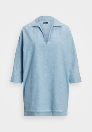 Light blue denim shirt with a collared, V-neck design and three-quarter sleeves. Features a relaxed fit and visible stitching details.