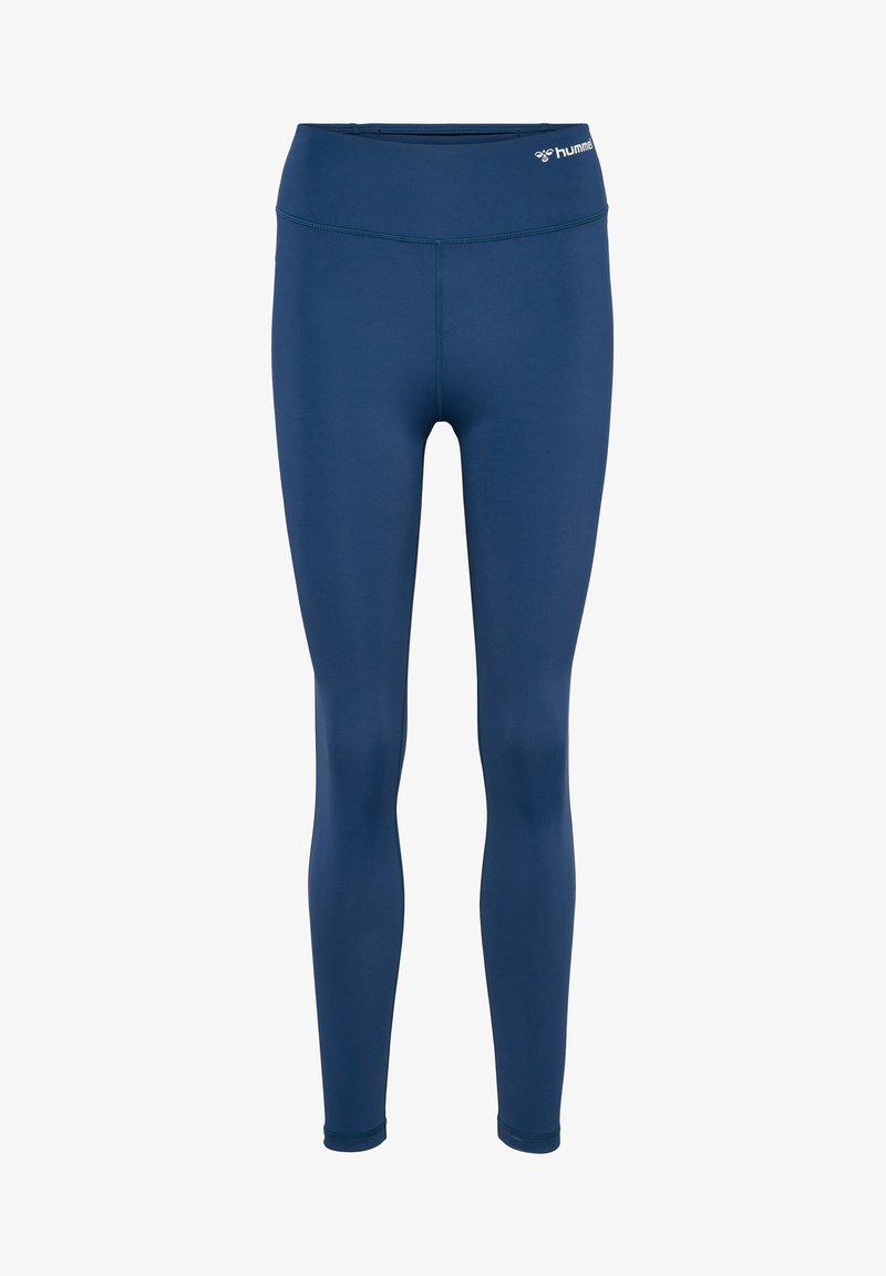 Granatowe legginsy wykonane z elastycznego materiału. Posiadają wysoki pas i bezszwowy design z logo na przodzie.