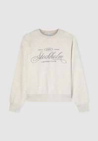 Felpa in cotone grigio chiaro con maniche lunghe e scollo a girocollo. Caratterizzata dalla scritta "Stockholm 1985 Leisure Club" in lettere grigio scuro.