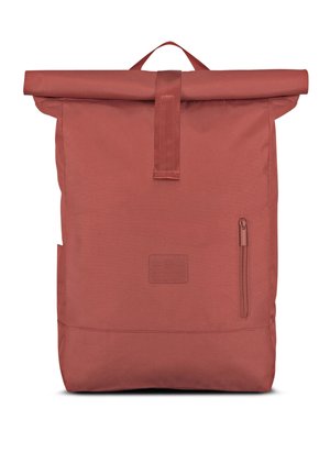 Rust-colored roll-top backpack with front zippered pocket and top handle, made of durable fabric.