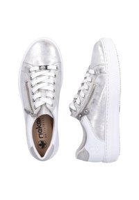 Silver metallic sneakers with a textured finish, white rubber sole, lace-up and side zipper design, featuring a logo on the tongue.