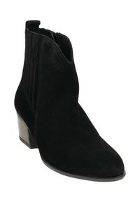 Zwarte suède enkellaars met een spitse neus en een blokhak. Voorzien van verticale elastische panelen voor een goede pasvorm en een ritssluiting aan de zijkant.