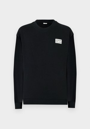 Black sweatshirt made of soft fabric, featuring a crew neck and long sleeves. Decorative logo patch on the front left chest area.