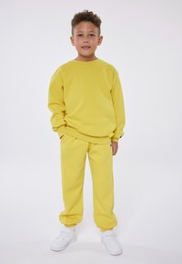 Champion EXCLUSIVE PANT UNISEX - Treniņtērpa apakšdaļas - yellow