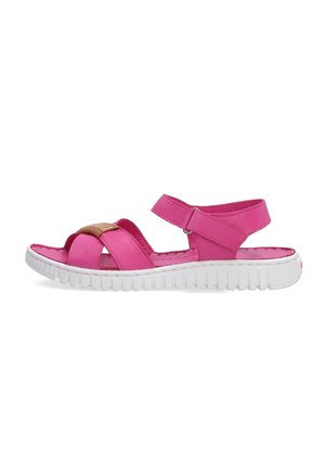 Pink synthetic sandals with crisscross straps, adjustable ankle strap, and textured white rubber sole. Notable tan accent on the upper.