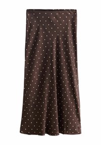 Hnědá sukně s bílými puntíky, s hladkou texturou a splývavým střihem. Spodní část je mírně rozšířená pro pohodlné nošení.