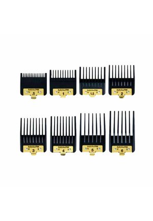 Acht zwarte haarclippers in twee rijen, gelabeld met maten van 0,5 tot 6 voor verschillende kniplengtes.