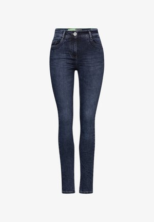 Jean slim bleu foncé avec poches avant, fermeture à boutons et détails légèrement délavés sur les cuisses et les genoux.
