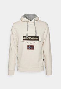 Hoodie color beige chiaro con interno grigio, cappuccio con cordoncino, grande patch con logo e ricamo della bandiera norvegese sul davanti. Materiale in misto cotone.