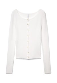 White ribbed long-sleeve top featuring a round neckline and front button closure with small, round, beige buttons.