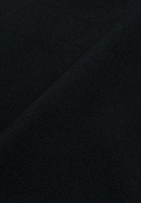 Black fabric with a fine, textured weave, displaying soft, even color. The surface appears smooth and uniform with no visible patterns.