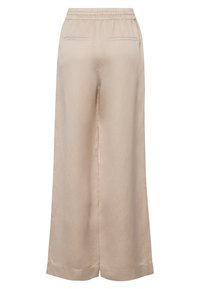 Beige weit geschnittene Hosen mit einem elastischen Bund, zwei Gesäßtaschen und einem weichen, leichten Stoff. Sie verfügen über eine glatte Textur und klare Linien.