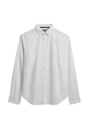 Chemise blanche en coton à manches longues avec un col à rabat, des boutons sur le devant, une poche poitrine simple et un ourlet courbé. Texture simple et lisse.