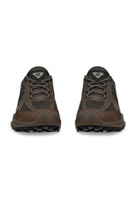 Brown athletic shoes featuring a textured fabric upper, synthetic accents, lace-up design, and rugged black outsole with prominent treads.