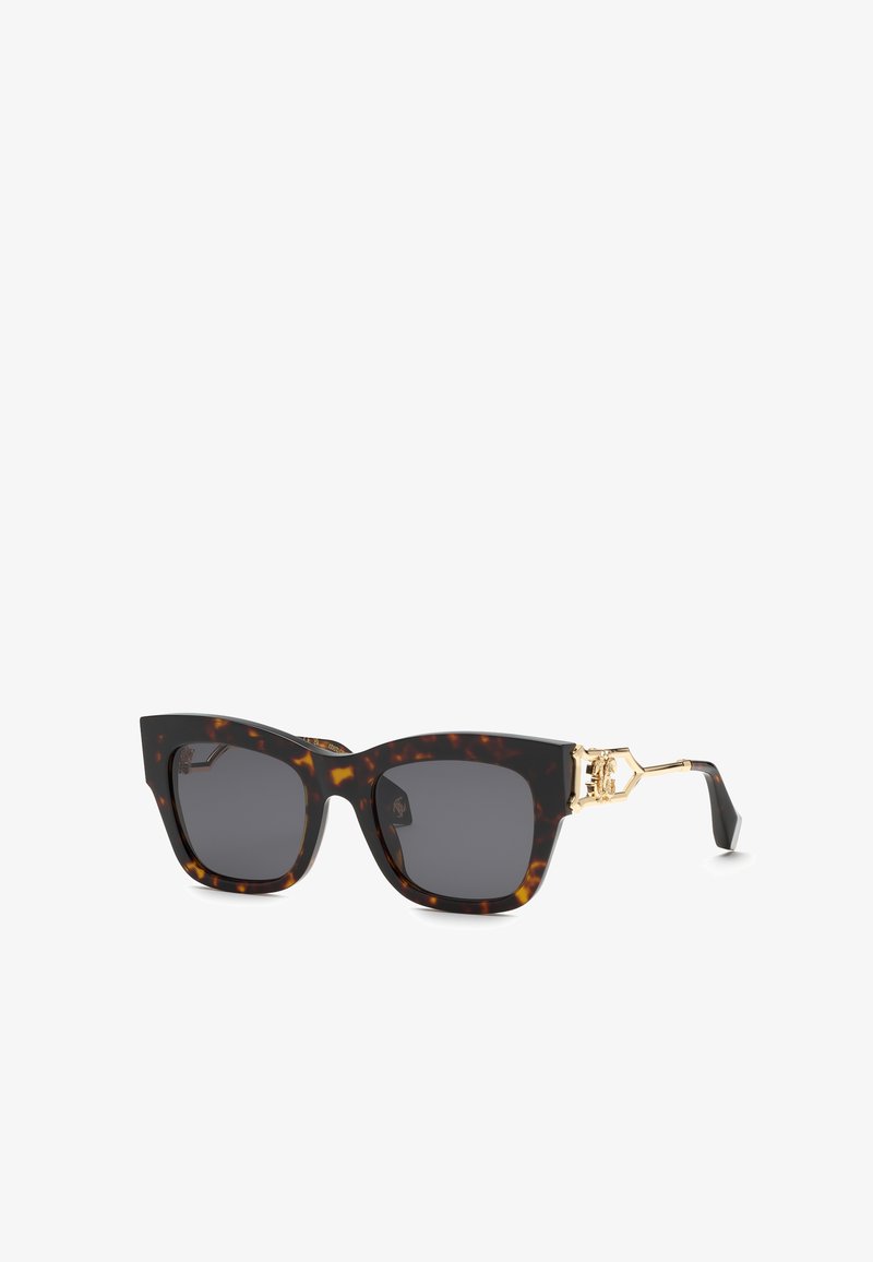 Lunettes de soleil carrées en écaille avec verres foncés et accents décoratifs dorés sur les branches.