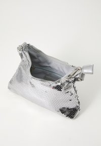 Silver sequin clutch bag with a zippered top and a smooth interior lining. Features a sleek, compact shape and silver hardware accents.