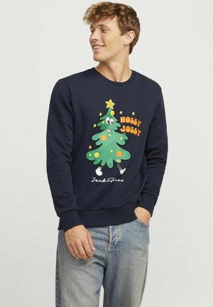 Marineblå sweatshirt med et cartoon-juletræ designet med en stjerne, smilende ansigt og farverige udsmykninger. Ribbet manchetter og kant.