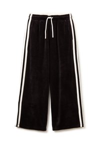 Pantalones de chándal de terciopelo negro con rayas laterales blancas, cinturilla elástica y cordón ajustable. Presentan un diseño holgado y cropped.