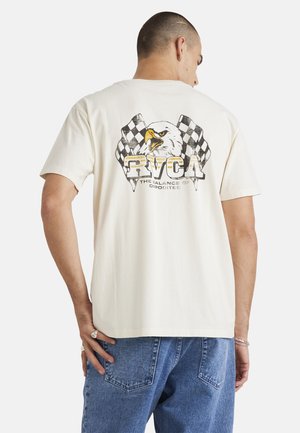 Cream-colored cotton t-shirt featuring an eagle graphic with checkered flags and "RVCA THE BALANCE OF OPPOSITES" text on the back.