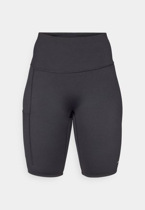 Sorte høye sykkelshorts laget av et elastisk materiale, med en sidelomme, myk tekstur og flate sømmer for komfort.
