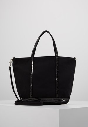 Black tote bag made of fabric with sequin accents, featuring two top handles and a detachable shoulder strap. Open-top design.