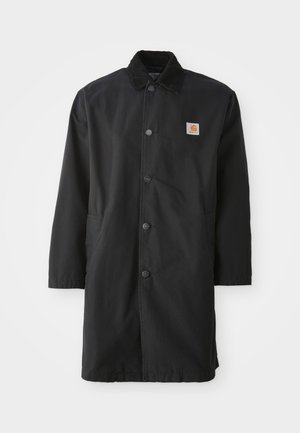 Black mid-length coat made of sturdy fabric, featuring a collared neck, front snap buttons, side pockets, and a small logo patch on the chest.